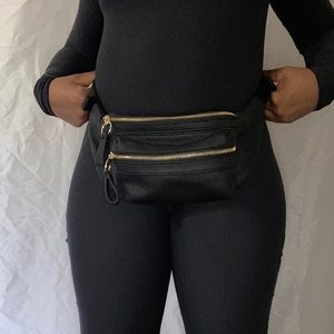 Black fanny pack with gold zippers